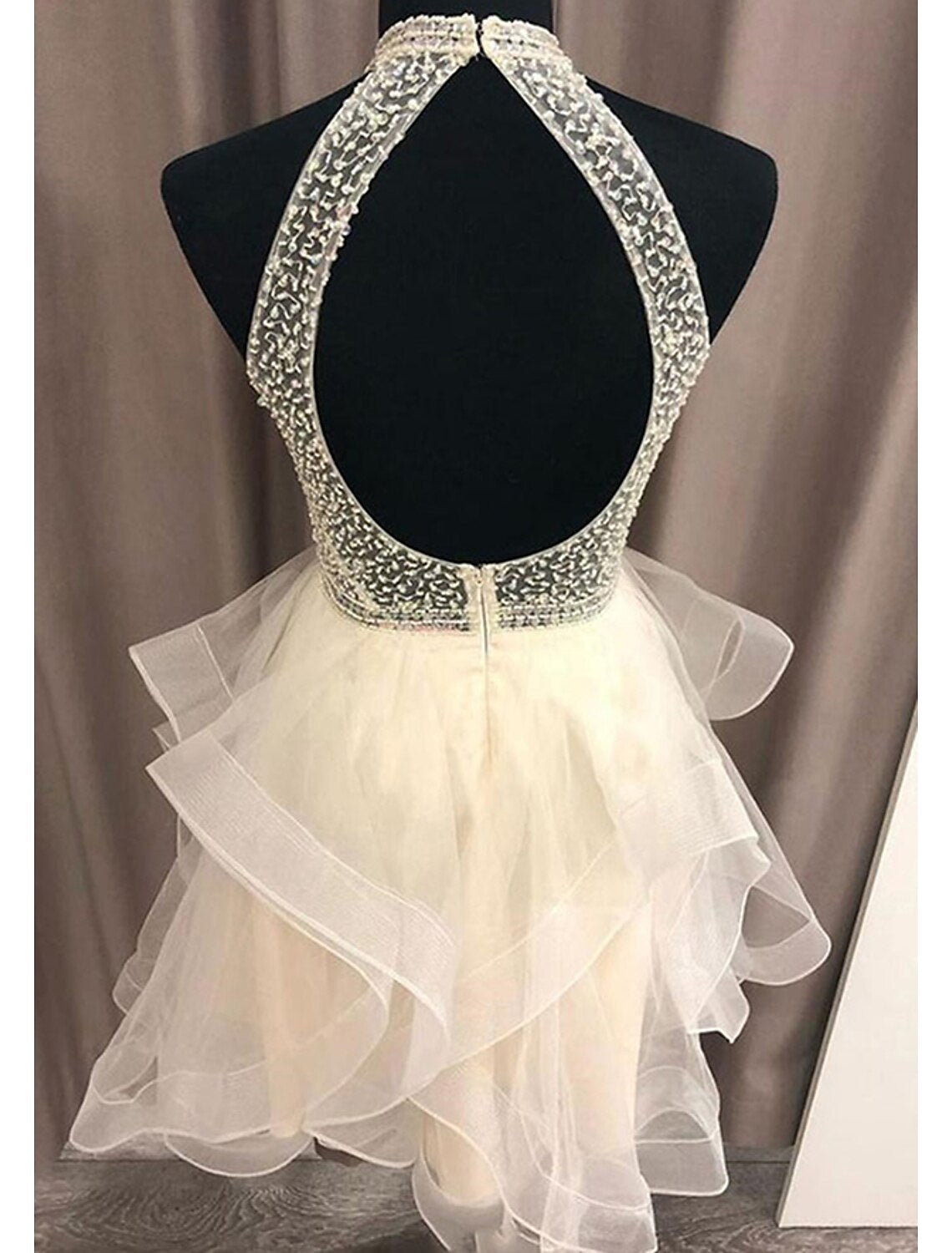 Side view of a short A-Line glitter organza homecoming dress.