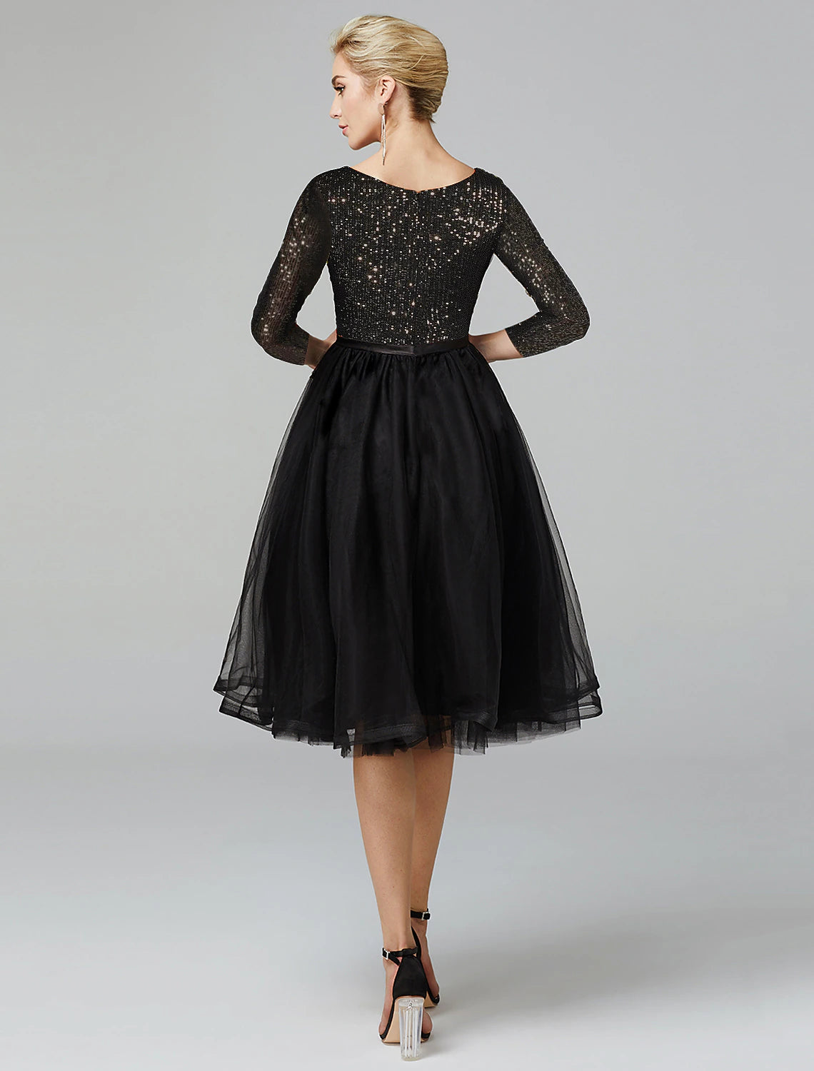 Side view of the elegant A-line dress, highlighting the sparkle.