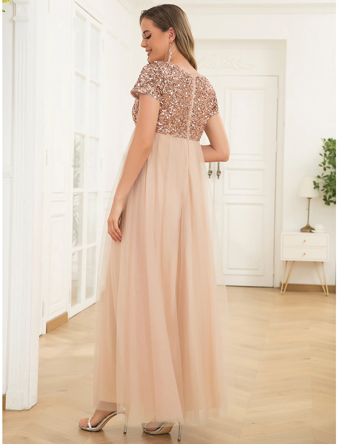 Back view of the elegant A-line maternity dress.
