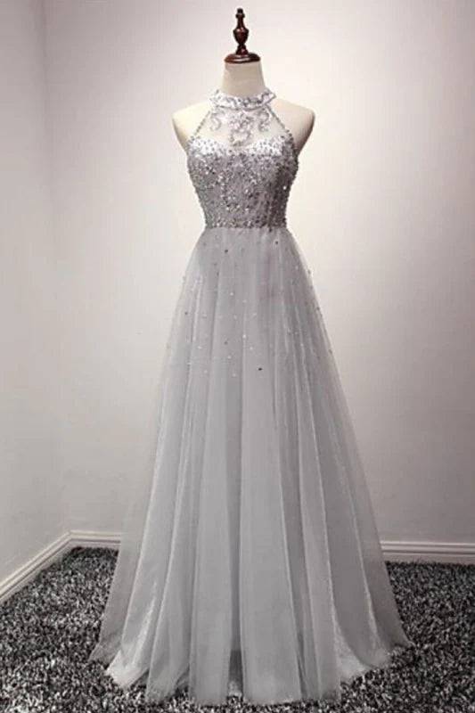 Elegant A-line prom gown with jewel neckline, sequins, and crystals.