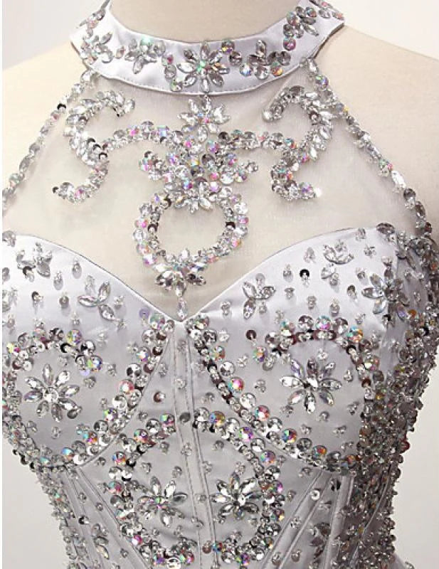 Full length view of the sleeveless A-line prom dress.