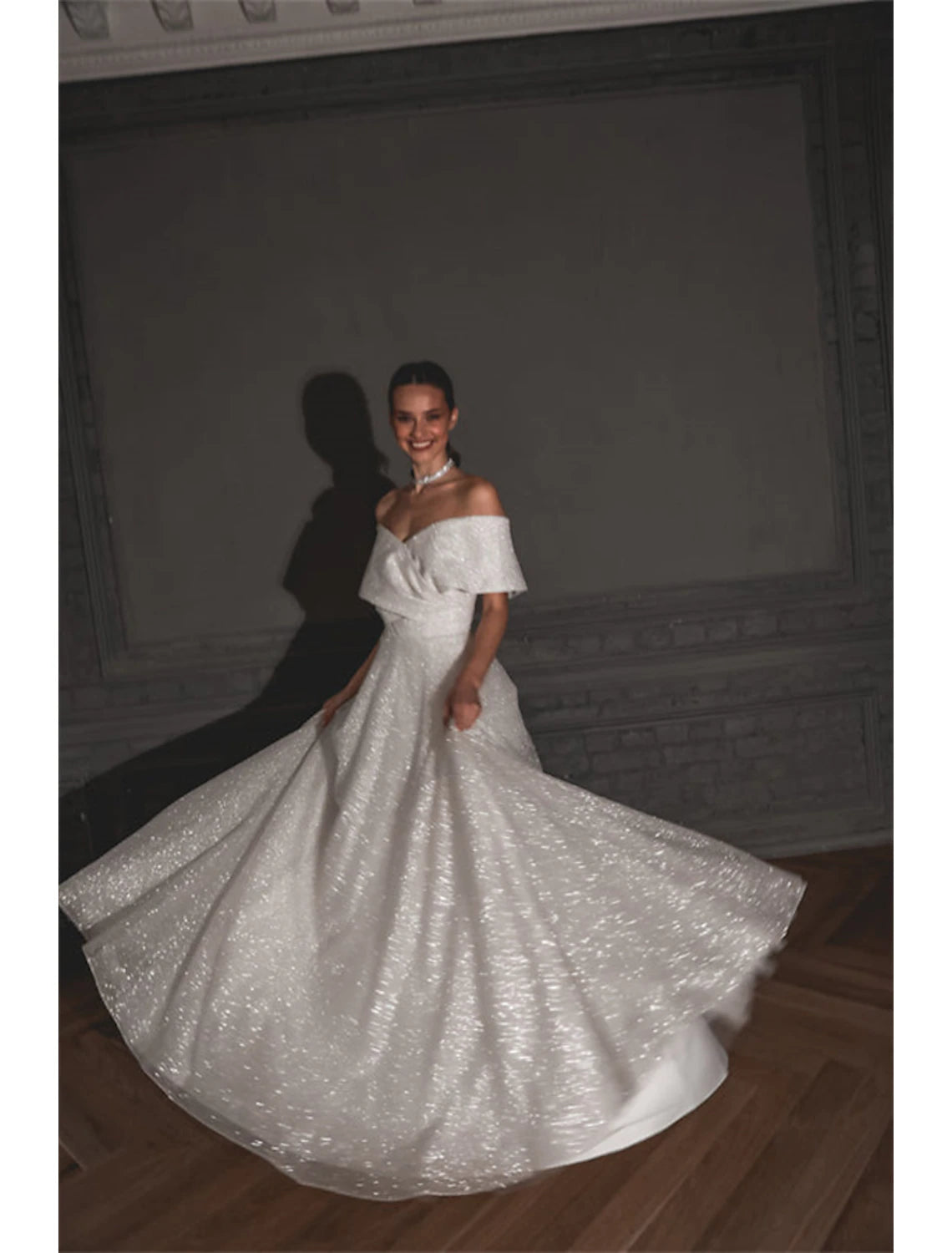 Back view of the sequined A-line wedding dress with sweep train.