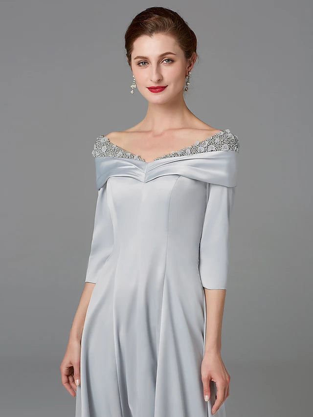 Side view of the elegant off-shoulder half-sleeve Mother of the Bride gown.