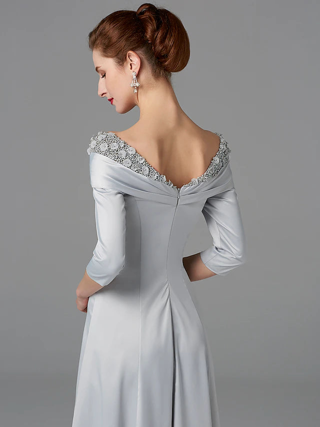 Detail of the half-sleeve and off-shoulder design of the formal dress.