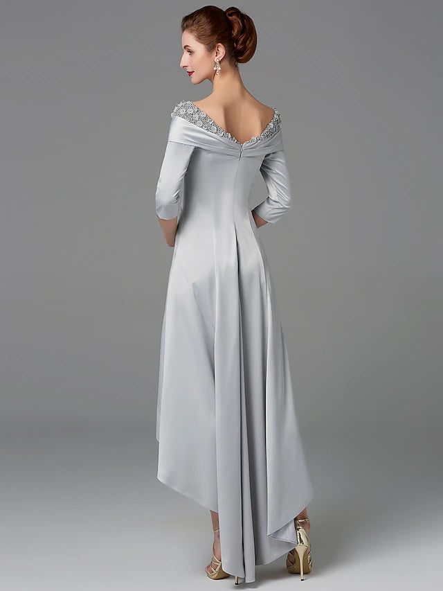 Mother of the Bride dress showing the asymmetrical hemline and satin fabric.
