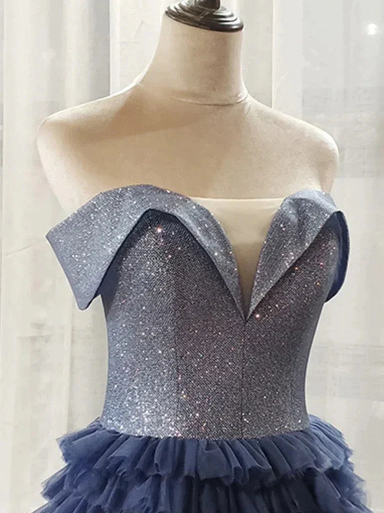 Close-up of the sequin fabric and off-shoulder neckline of the dress.
