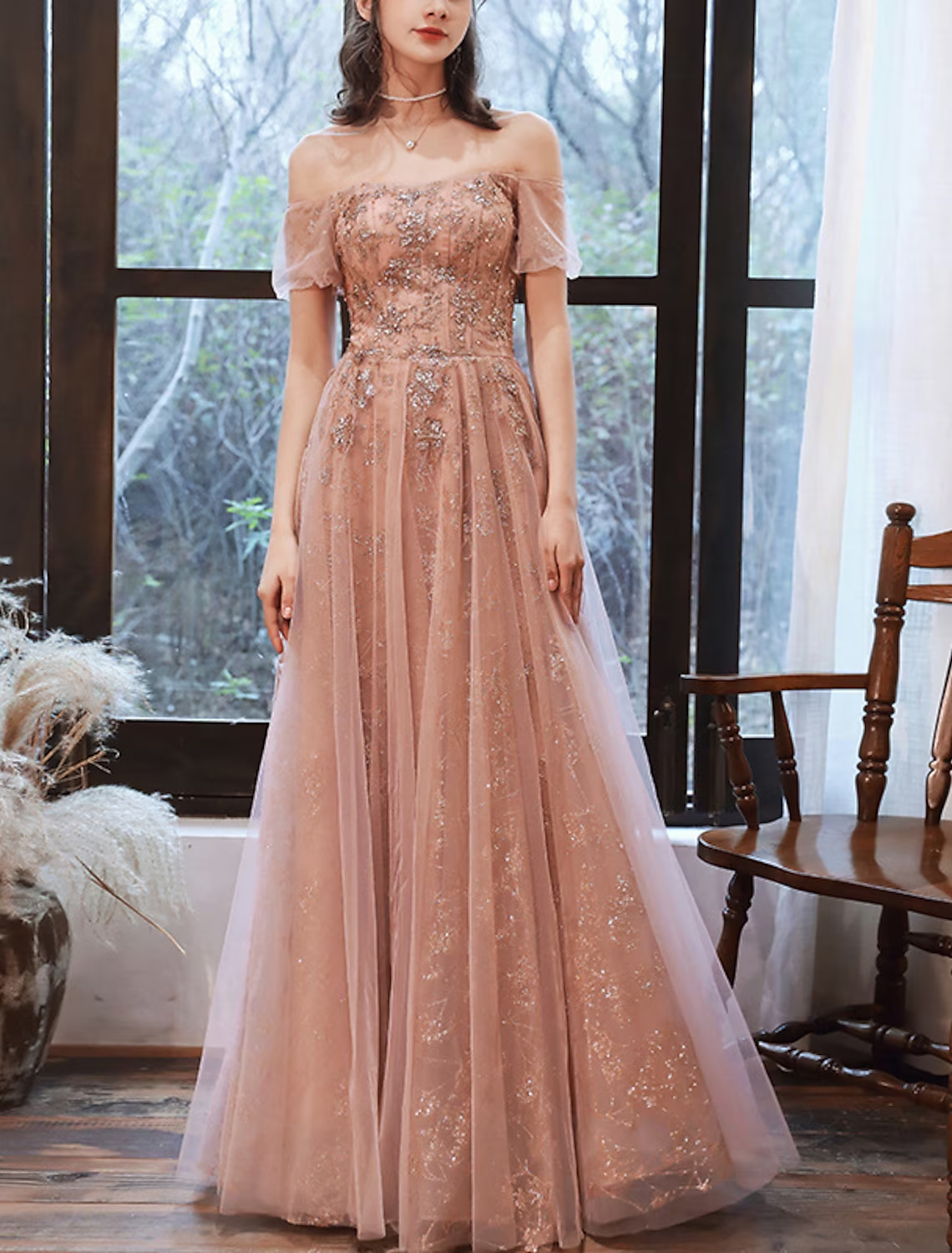 Full back view of the glittering A-line evening gown.