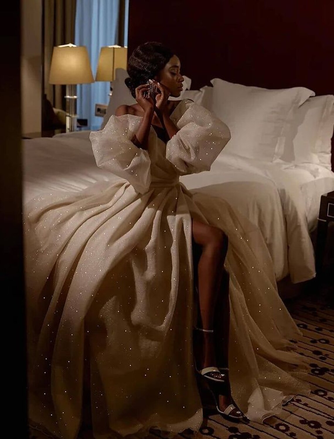 Side view of the floor-length A-line wedding dress with a high split.