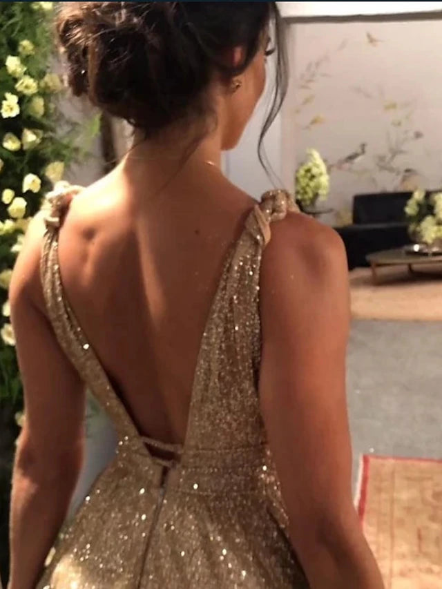 Close-up of the glittering fabric and rhinestone embellishments on the A-line prom dress.