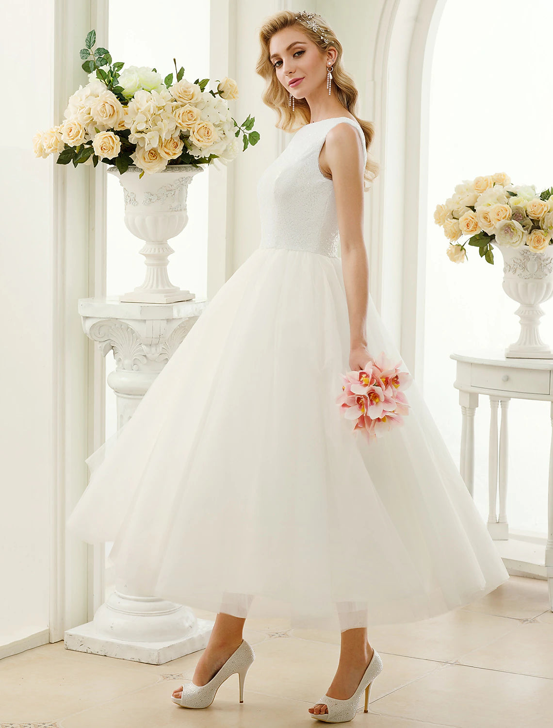 Flowing tulle skirt of tea length bridal gown.