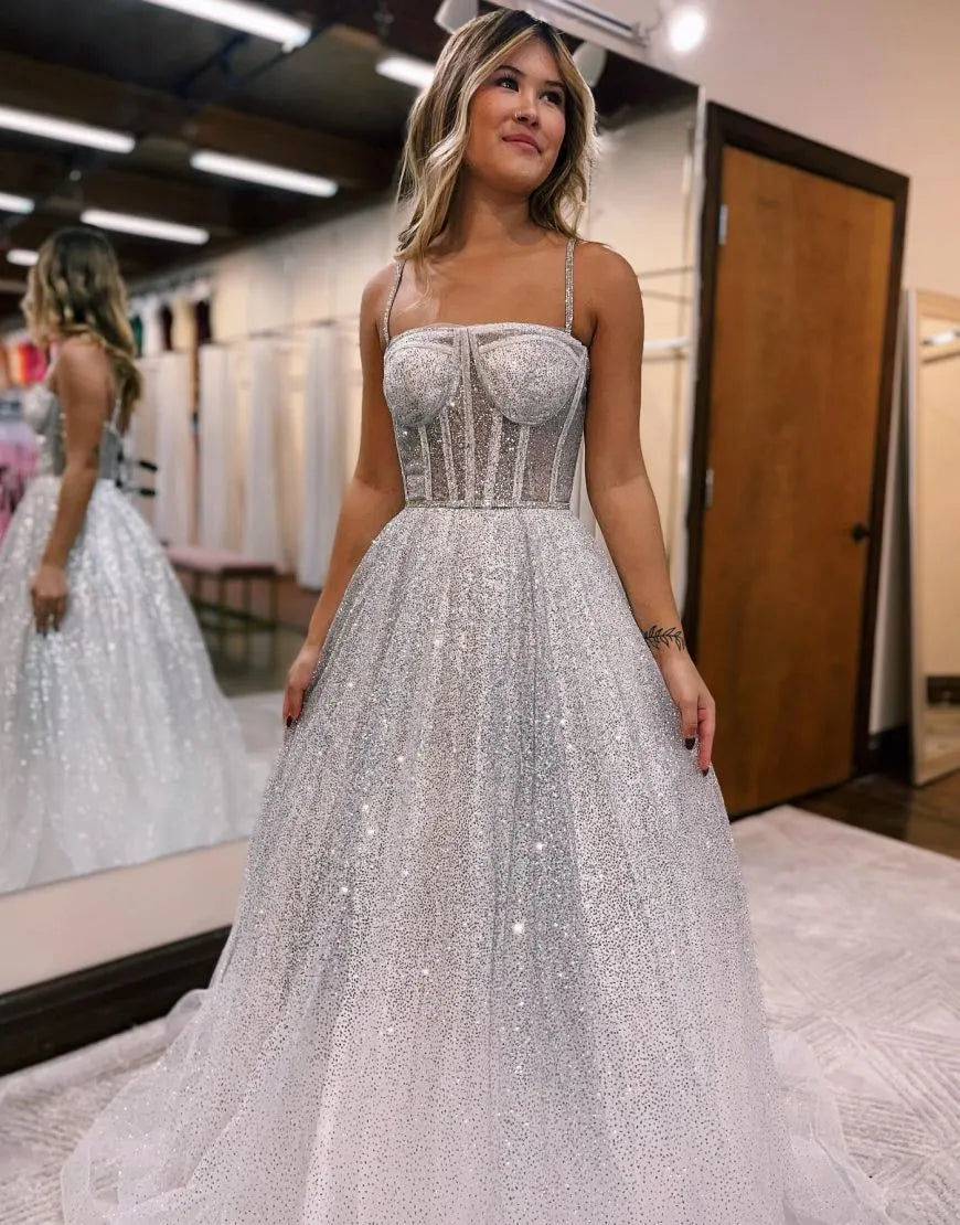 Side profile of a bride wearing an A-line tulle organza wedding gown.