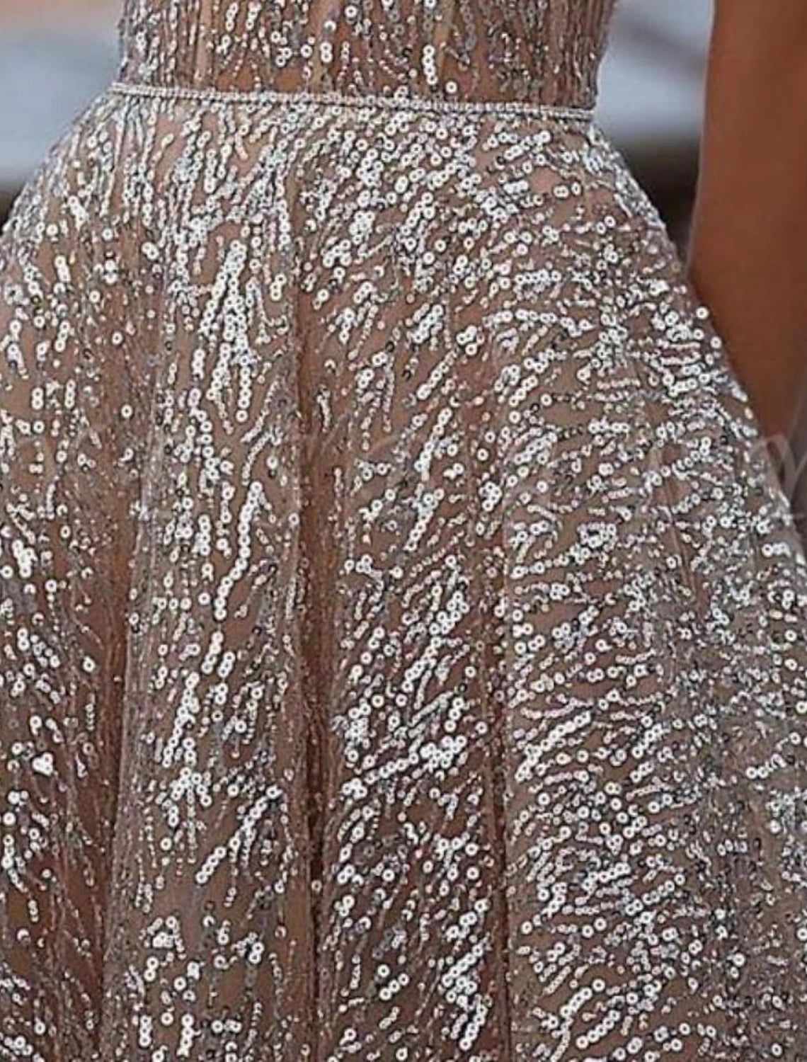 Sparkling A-line strapless tea length evening gown with sequin and tulle details.