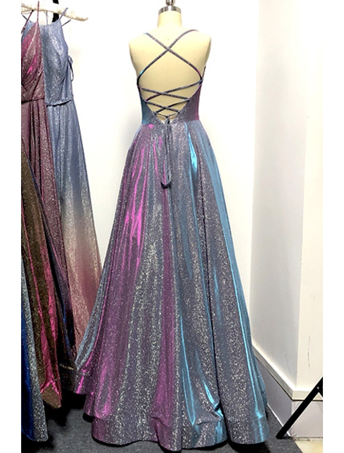 Close-up of the stretch satin fabric and sparkling detail on the A-line prom dress.