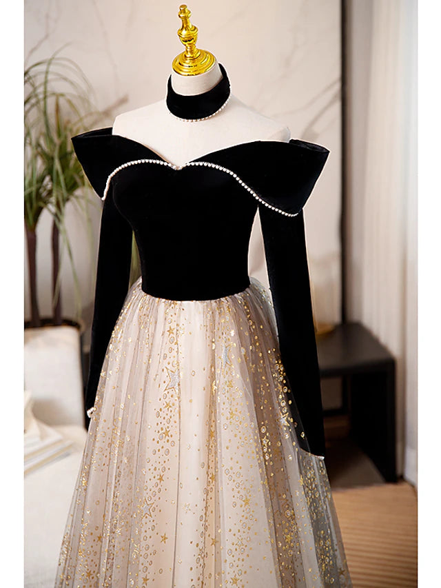 Close-up of the sequin and tulle fabric on a sparkling A-line prom dress.