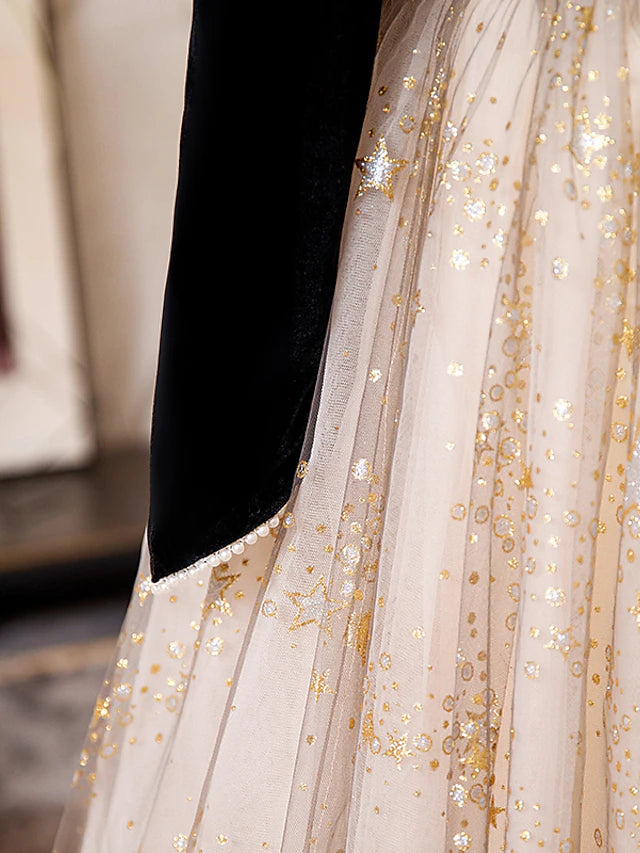 Side view of a model showcasing the flowing skirt of a sparkling A-line prom dress.