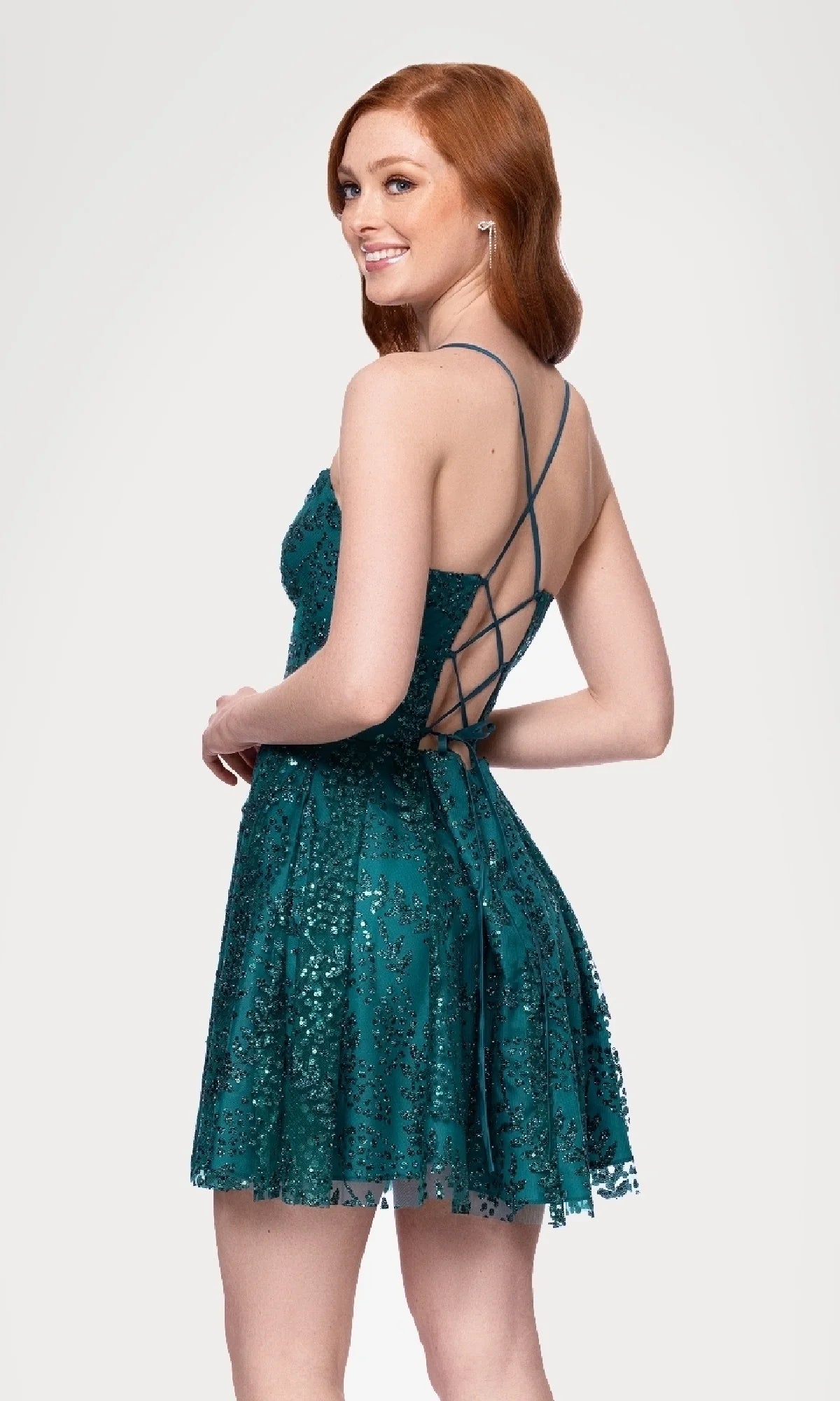 Close-up of the glitter mesh A-line short dress, showing lace-up back detail and sweetheart neckline.