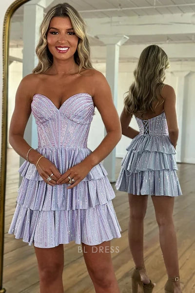 Lavender sequin A-line short homecoming dress with sweetheart neckline and ruffled tiers.