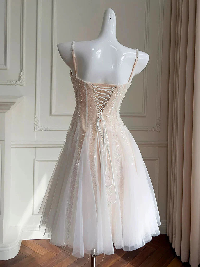 Side view of the sparkling A-line short dress, highlighting the tulle skirt.