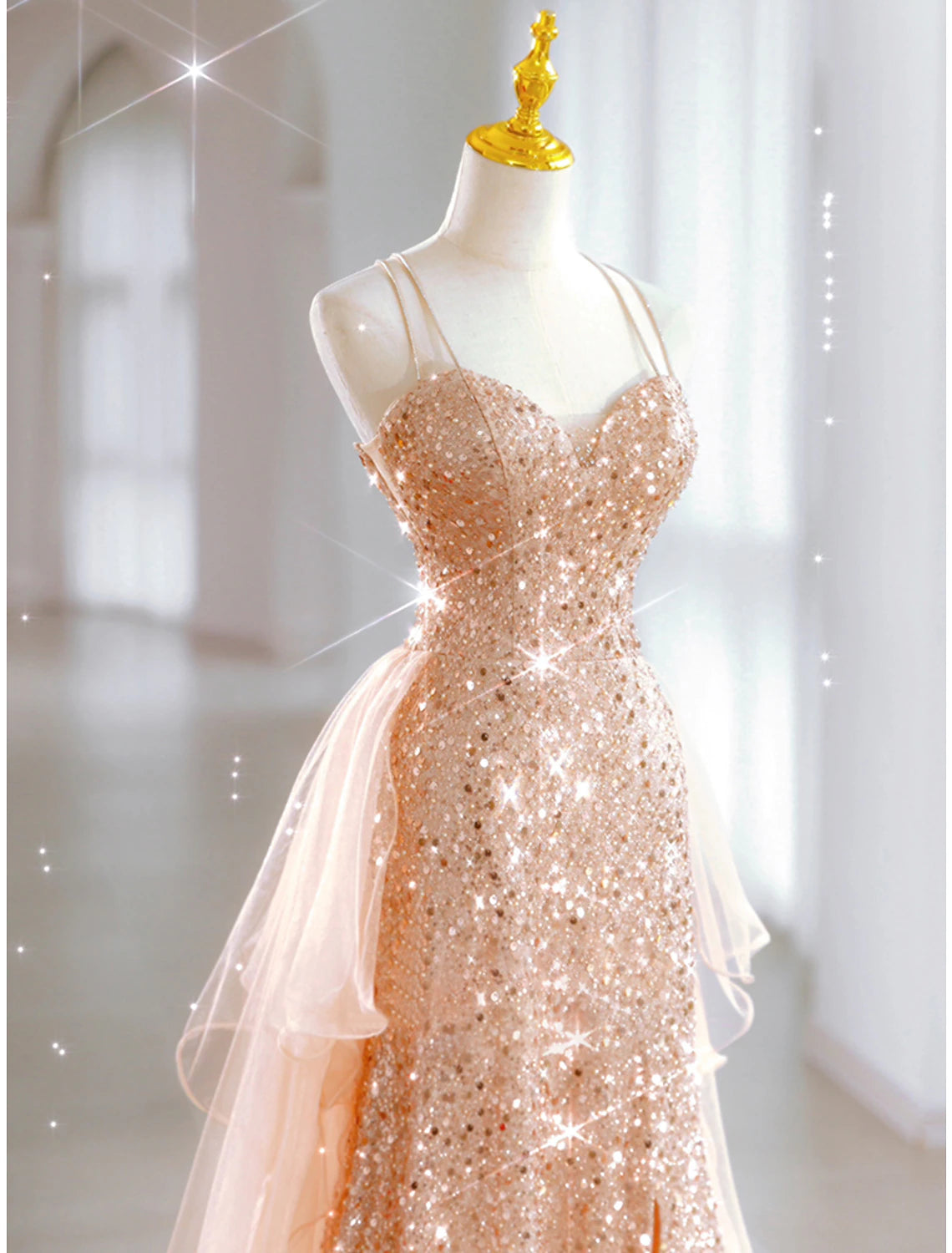 Model posing in a sleeveless sweetheart A-line gown.