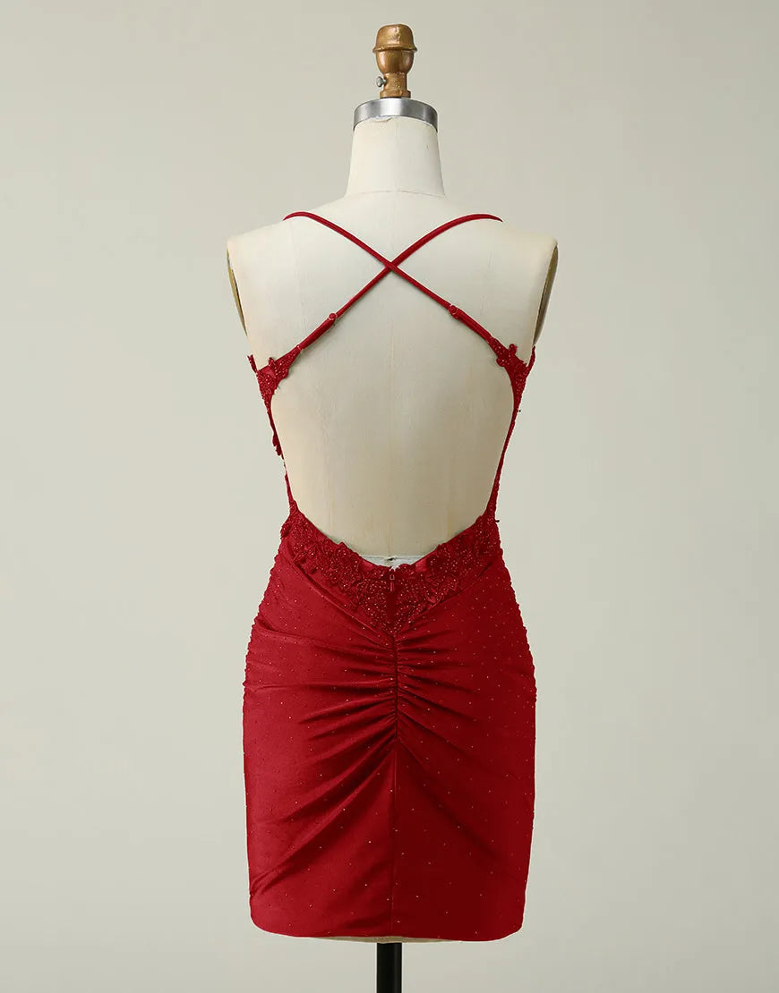 Back view of sparkling A-line short glitter homecoming dress with cross-back straps.