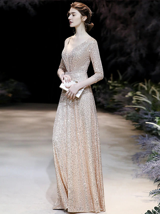 Side view of a woman in a sparkling A-line V-neck prom dress, highlighting the 3/4 sleeves and pleated skirt.