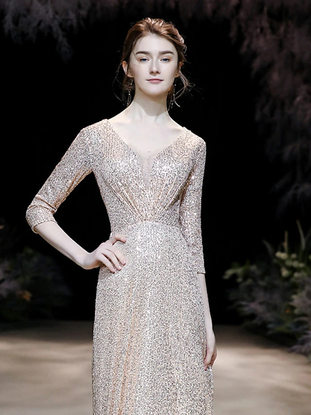 Close-up of the sequined fabric and V-neckline of the A-line prom dress.