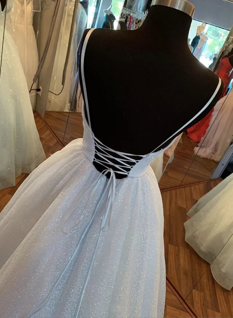 Full length view of a sparkling A-Line V-Neck evening gown.