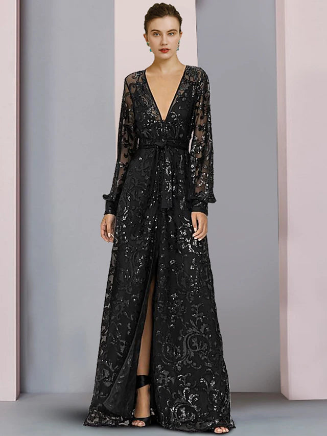 Model wearing a sparkling A-line V-neck long sleeve lace sequined floor-length gown.