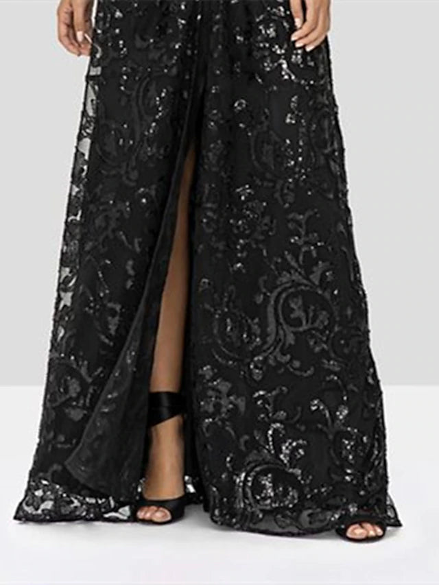 Close-up of the lace and sequin details on the sparkling A-line V-neck long sleeve gown.