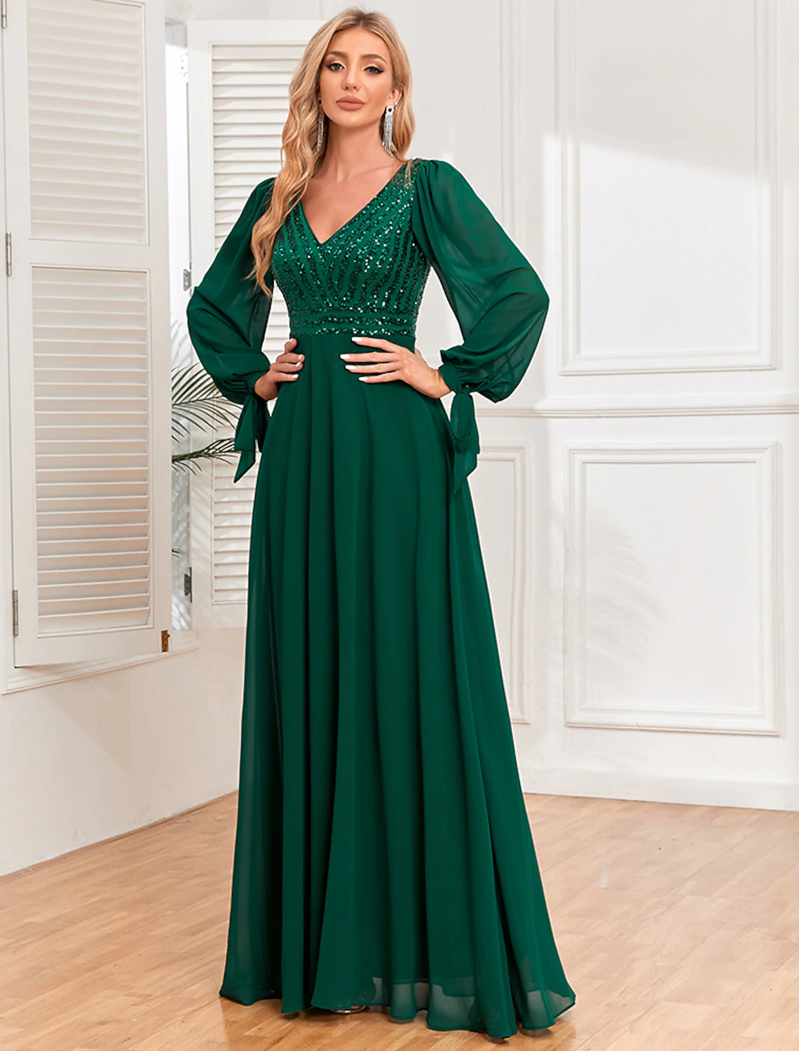 Model wearing a sparkling A-Line V-neck long sleeve sequin chiffon evening gown.