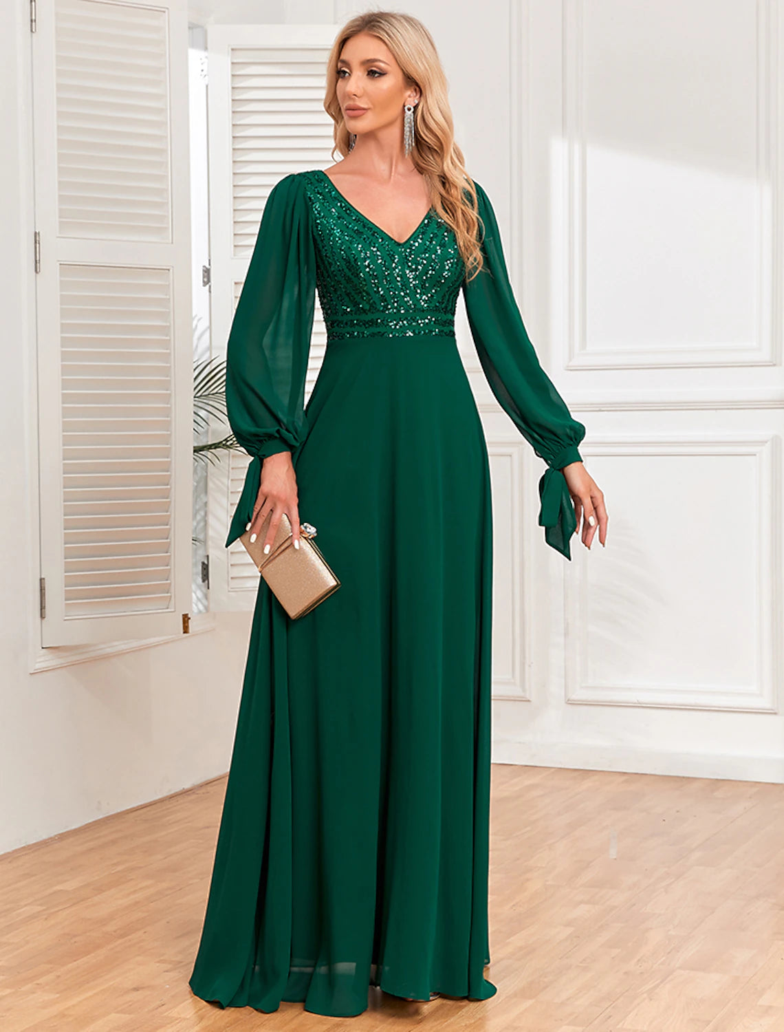 Back view of the A-Line V-neck long sleeve sequin chiffon evening gown.