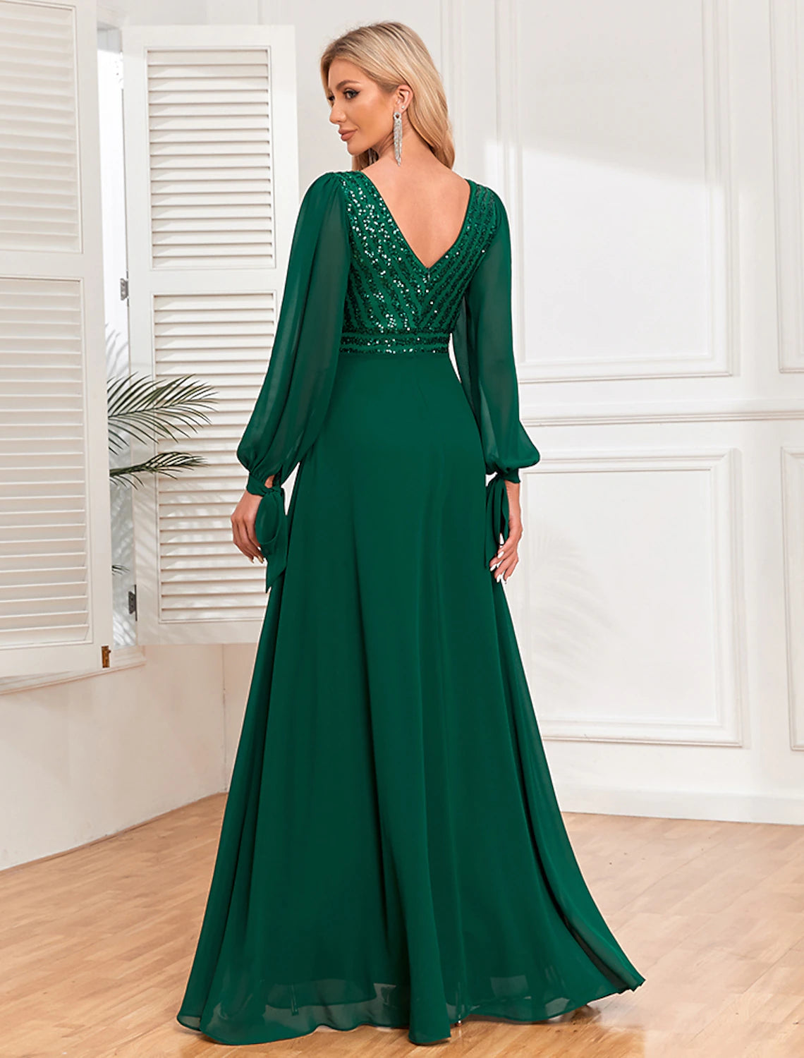 Side view of the A-Line V-neck long sleeve sequin chiffon evening gown.