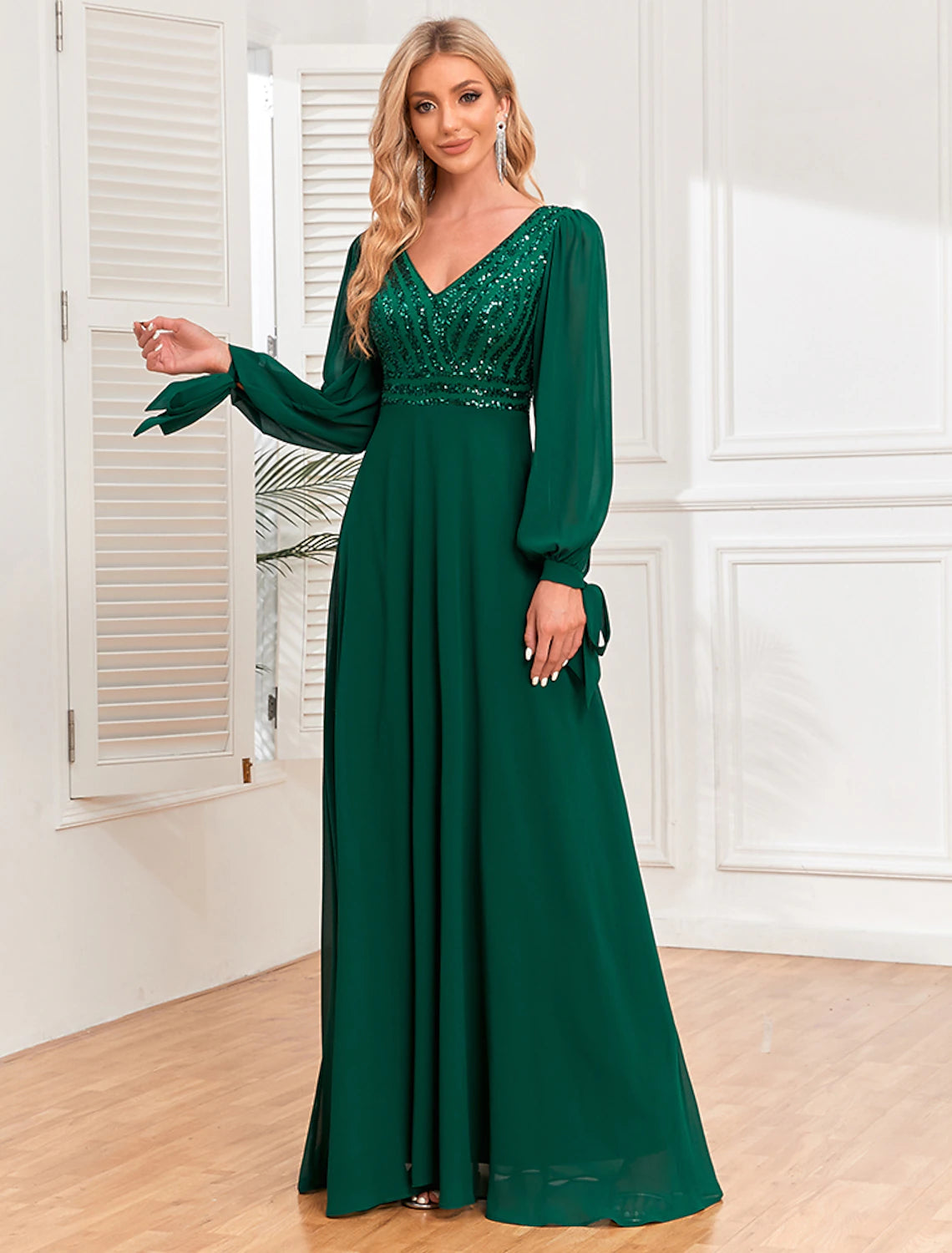 Model posing in the elegant A-Line V-neck long sleeve evening gown.