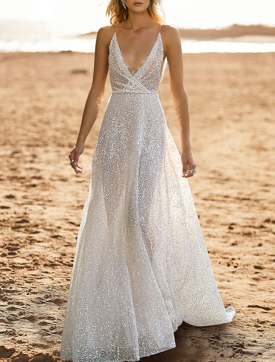 Back view of a sequined A-line wedding dress showing the open back design.