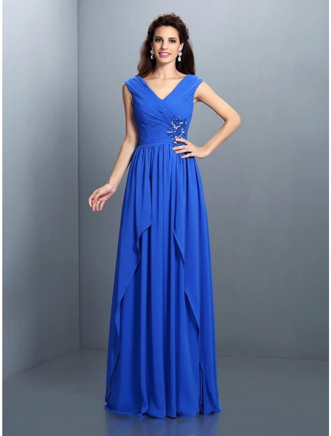 A-line V-neck evening gown with sparkling sequins and rhinestones.