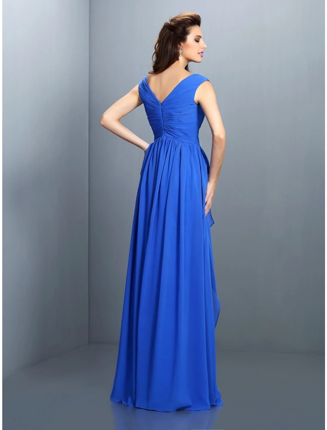 Close-up of the sequin and rhinestone detailing on the V-neck gown.