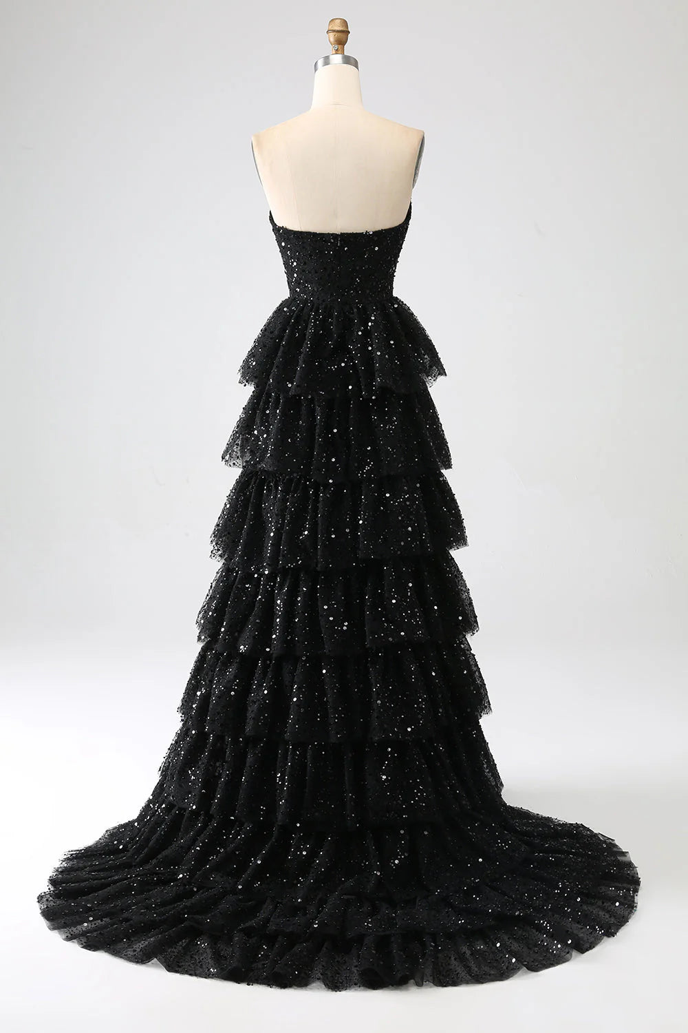 Side view of black sequin A-line prom dress with elegant V-neck.