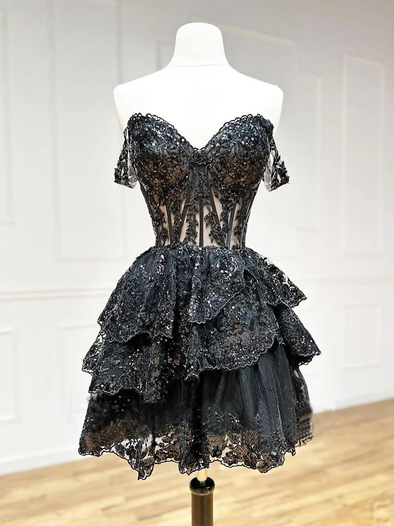 Model wearing a sparkling A-line V-neck sequin tulle short prom dress, front view.