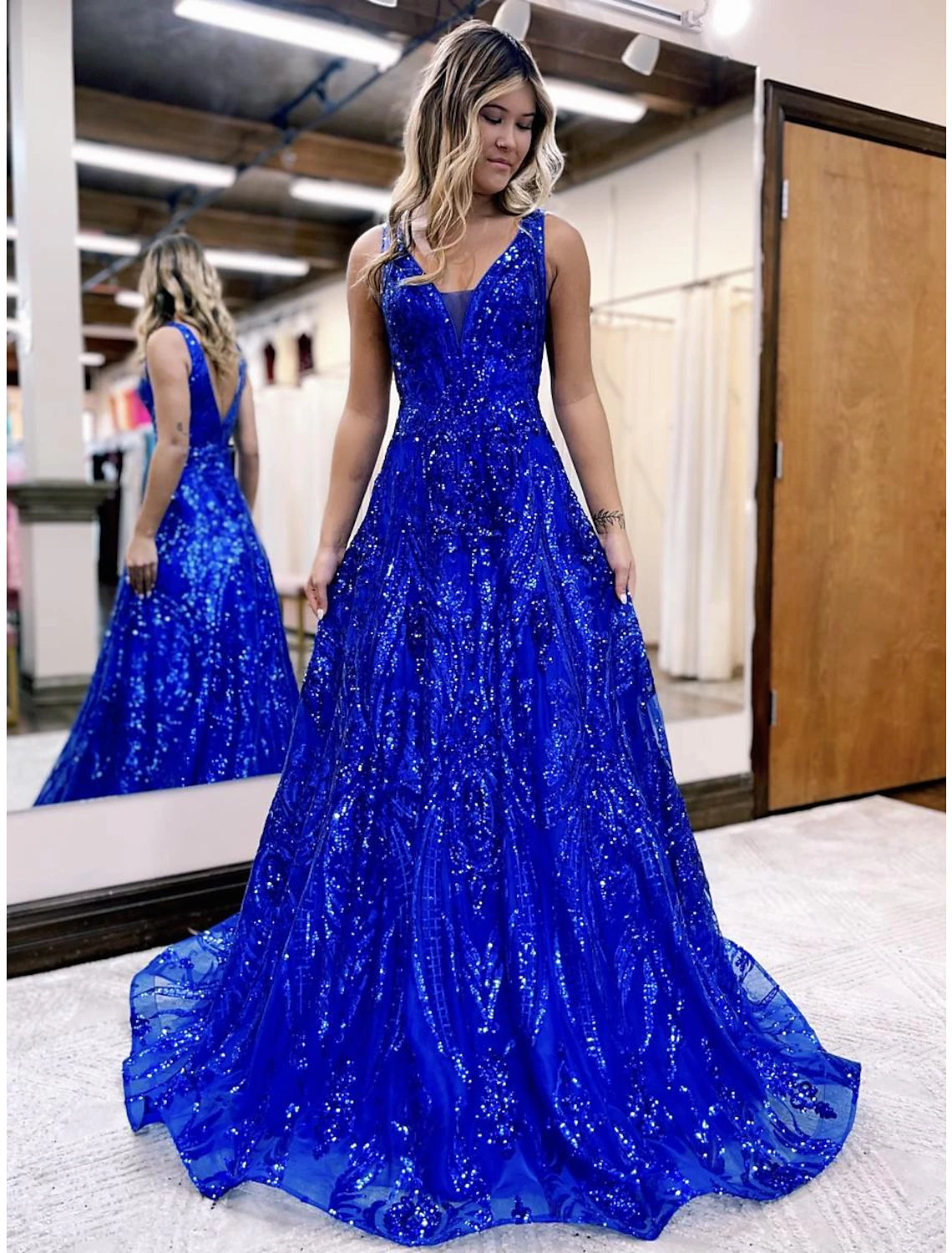 Sparkling A-Line V-Neck sequined prom dress with a floor-length silhouette.