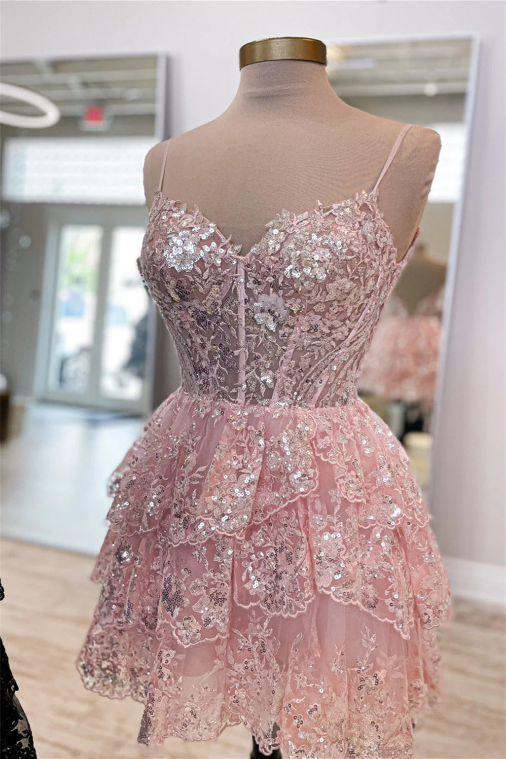 Close-up of the sequin and tulle detail on a lavender party dress.