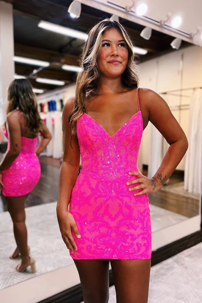Model posing in a sleeveless V-neck sequin short dress.