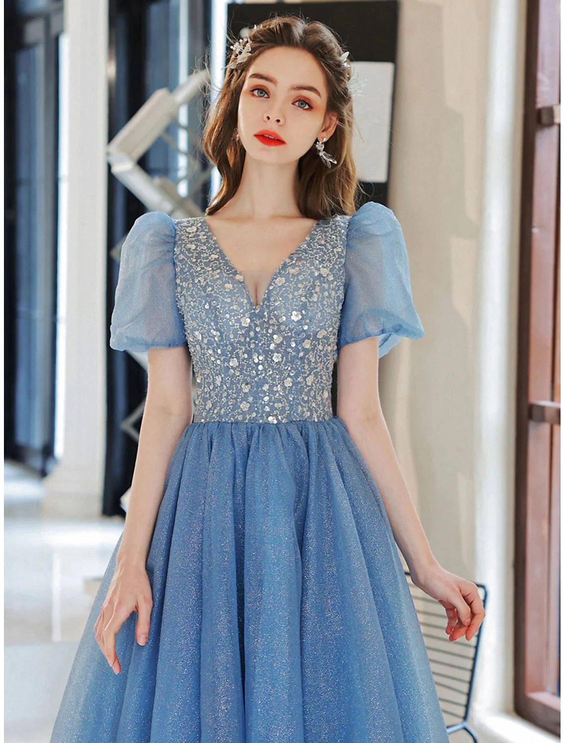 Side profile of the V-neck short sleeve prom dress, highlighting its silhouette.