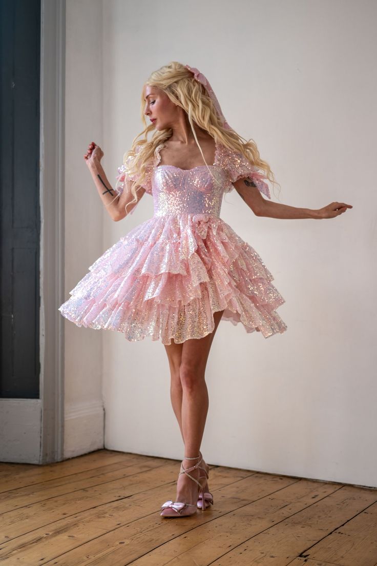 Model wearing a sparkling A-line V-neck short sleeve homecoming dress.