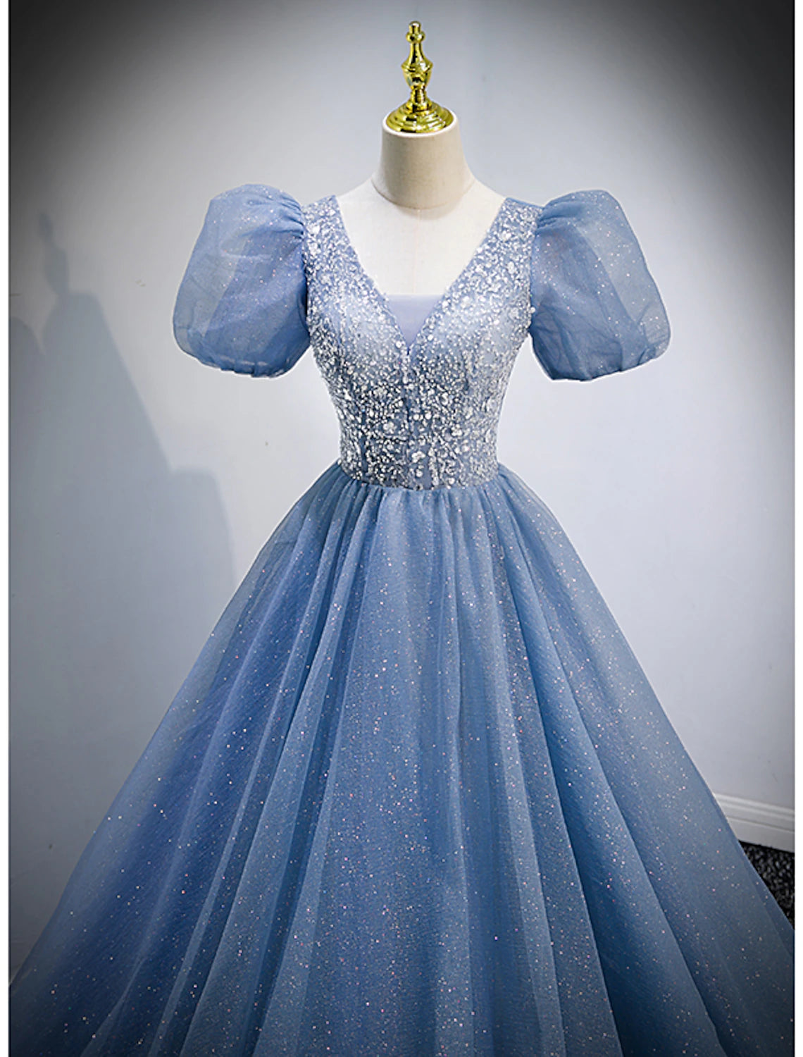 Back view of the A-line V-neck short sleeve sequin tulle floor length dress.