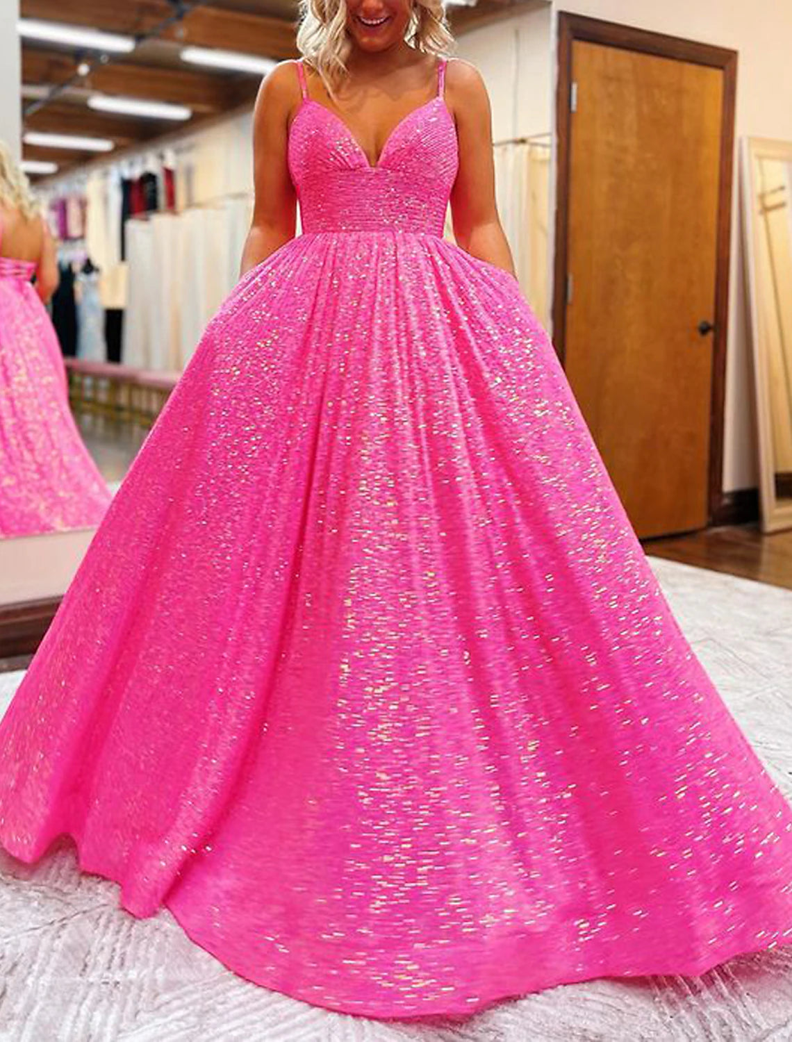 Side profile of the elegant A-line sequined prom dress, showcasing the sweep train.
