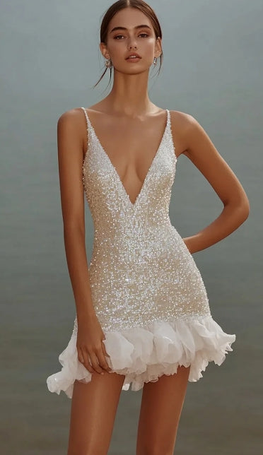 Sparkling A-line V-neck mini dress with spaghetti straps.