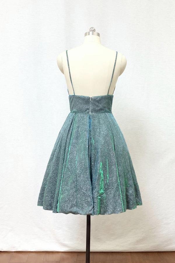 Close-up of a glitter short homecoming dress featuring spaghetti straps and a V-neck.