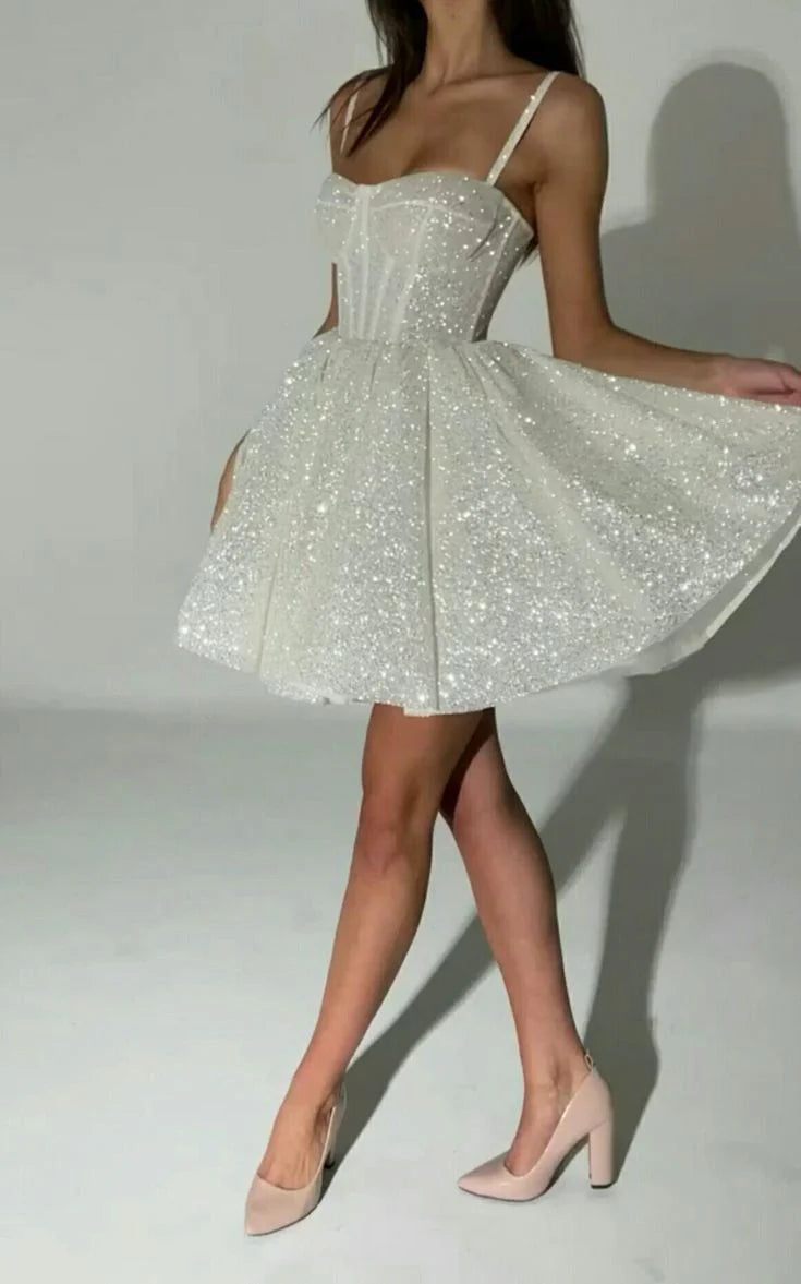 Sparkling A-line short prom dress with spaghetti straps.