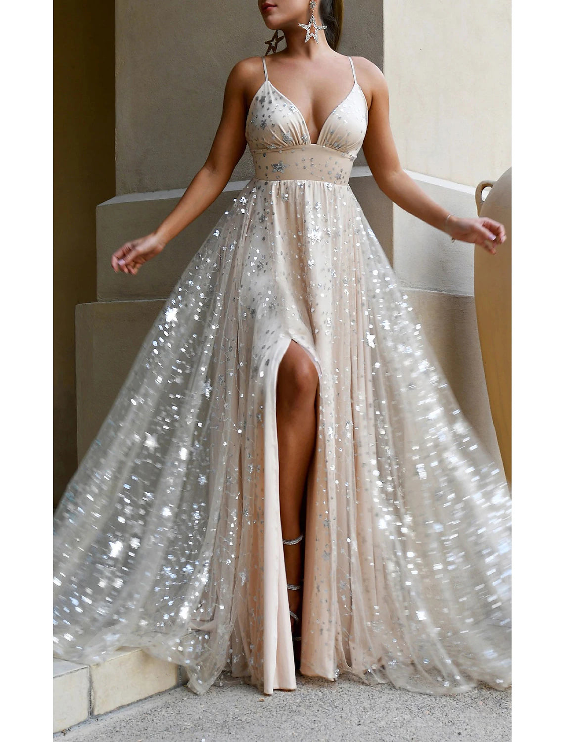 Back view of the sleeveless V-neck prom dress with sequin details.