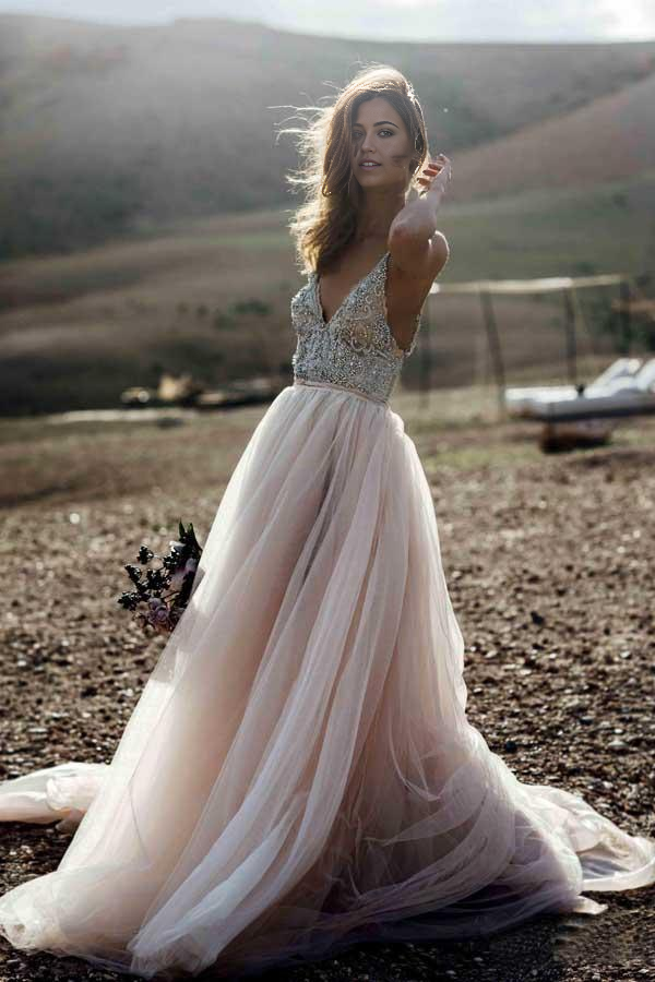 Full view of a sparkling A-line V-neck wedding dress with intricate beading.